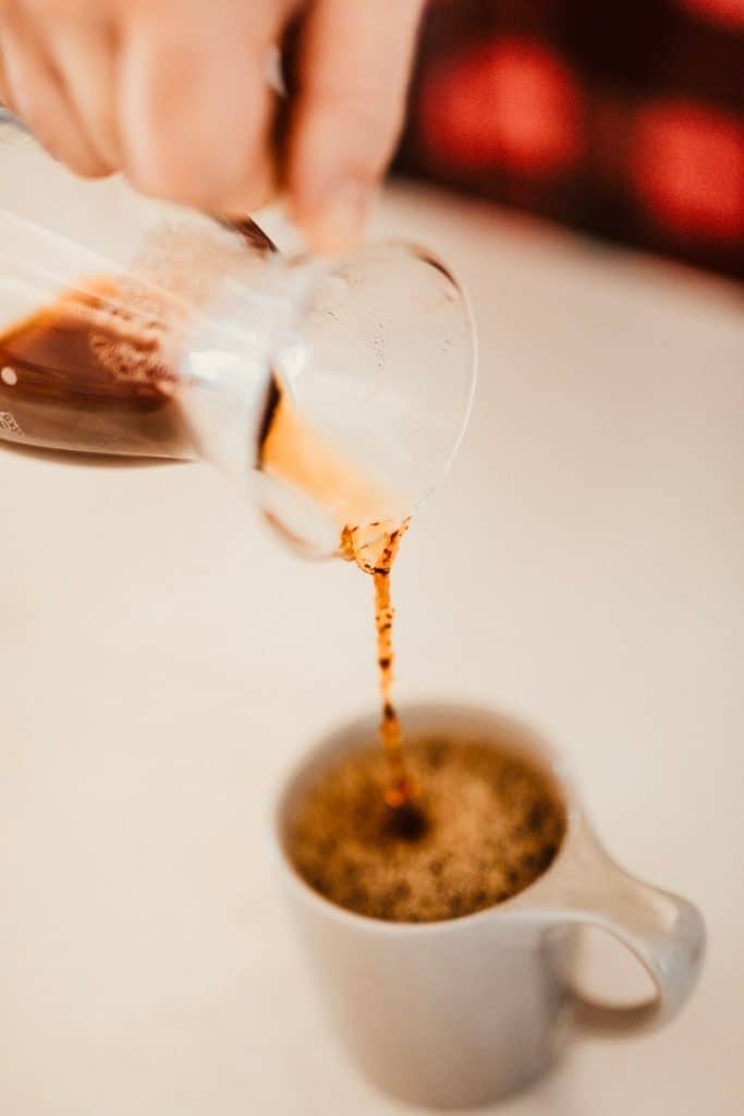 Pouring coffee out of chemex coffee maker