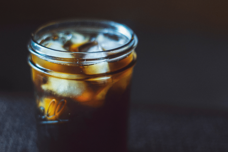 Cold brew coffee served in a mason jar with ice