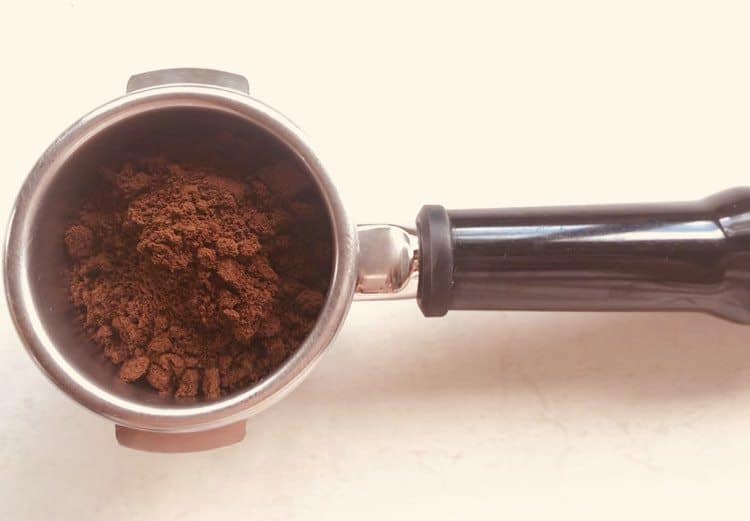 Portafilter with coffee ground for espresso by Rancilio Rocky Espresso Grinder