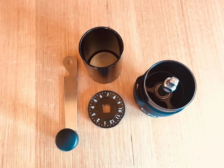 Photo of Aergrind hand grinder separated into parts