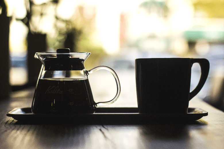 Photo of carafe of coffee and cup
