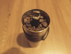 Porlex Mini hand grinder filled with coffee beans