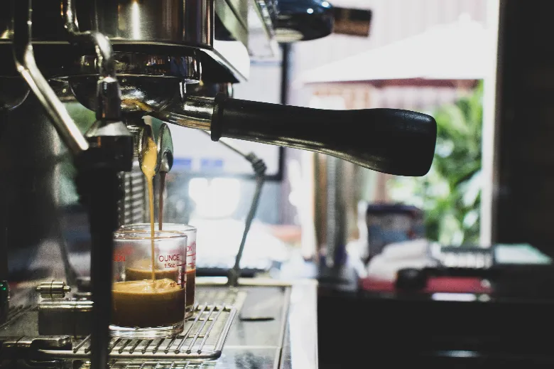 Commercial espresso machine pulling a shot